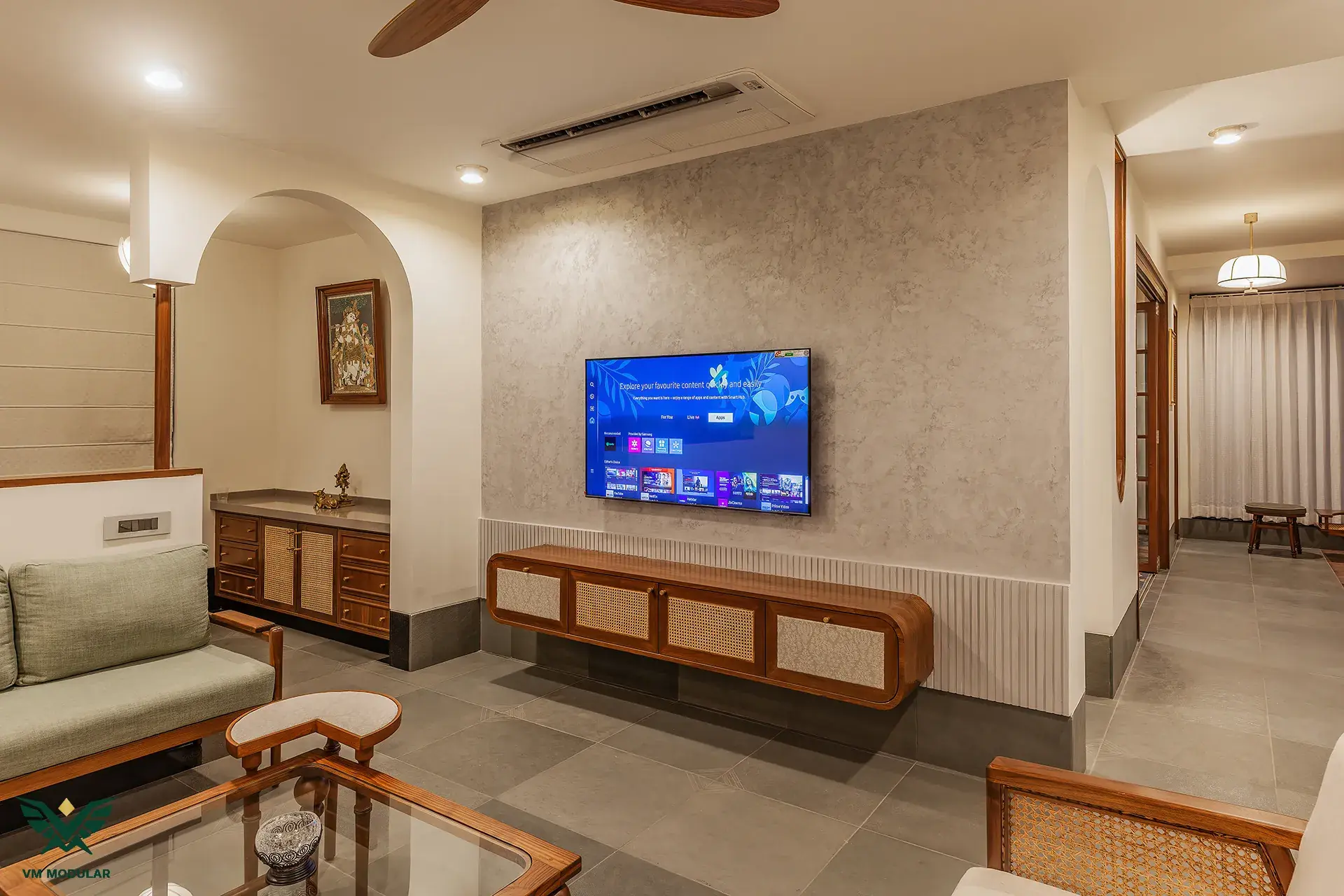 Teak and rattan living room with a fluted media wall, Banjara Hills